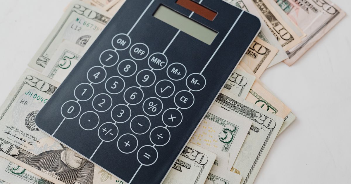 Calculator and billing costs on a desk