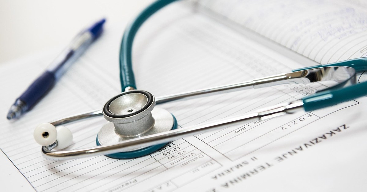 Stethoscope resting on a medical chart