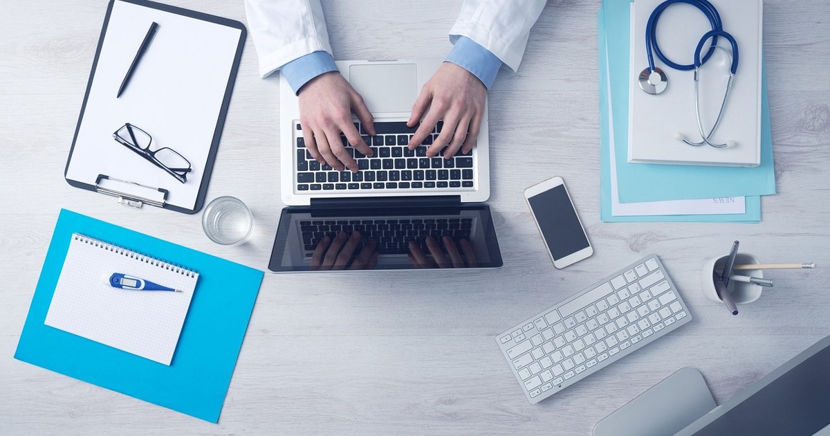 Doctor providing a telehealth consultation on a laptop